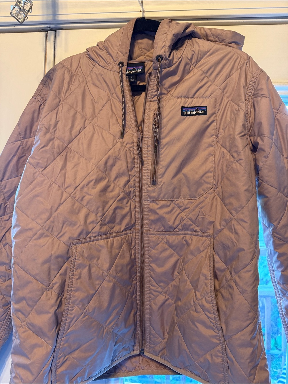 Patagonia women’s Quilted Hooded Puffer Jacket in Tan